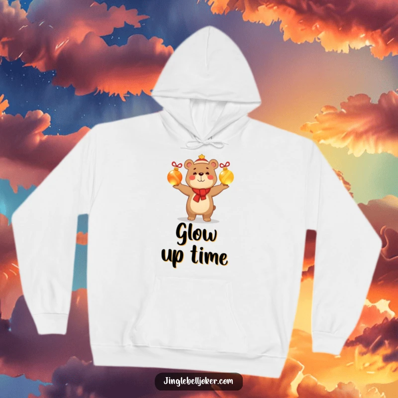 Funny hoodie featuring a smug, happy bear character juggling glowing Christmas baubles, perfect for staying warm and humorous during holidays.