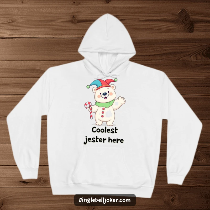 Funny hoodie showcasing a happy polar bear in a jester costume, striking a funny pose with a candy cane, embodying whimsical delight.