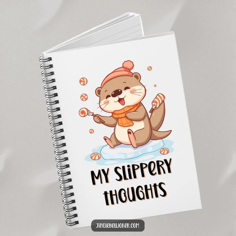 Funny notebook cover showing a cute otter character slipping on ice, juggling festive candies with a comical, determined expression.