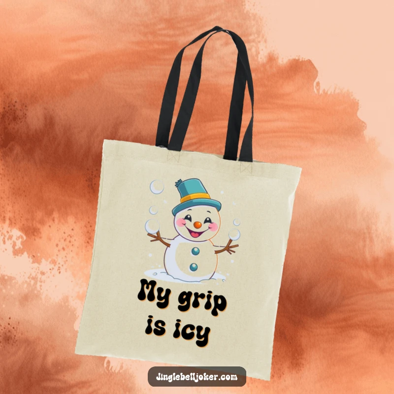 Funny snowman tote bag vividly illustrating a joker snowman mid-snowball toss, perfect for carrying essentials with humor.