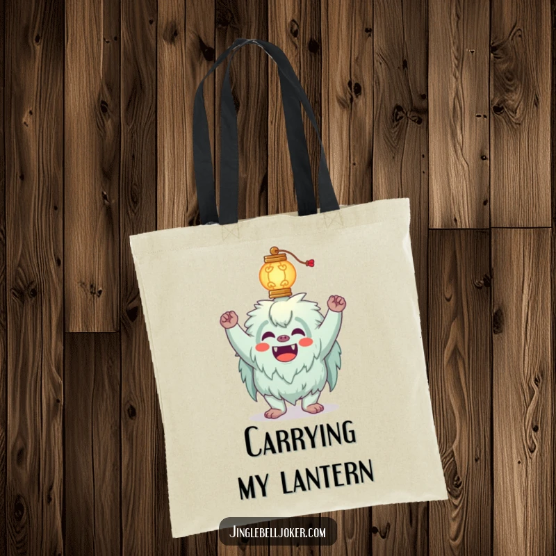 Funny Yeti Tote Bag with a silly yeti joker attempting to balance a glowing lantern on its head, perfect for carrying items.